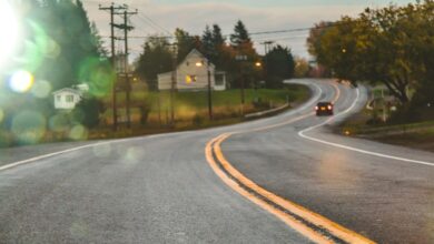Car driving on road in evening